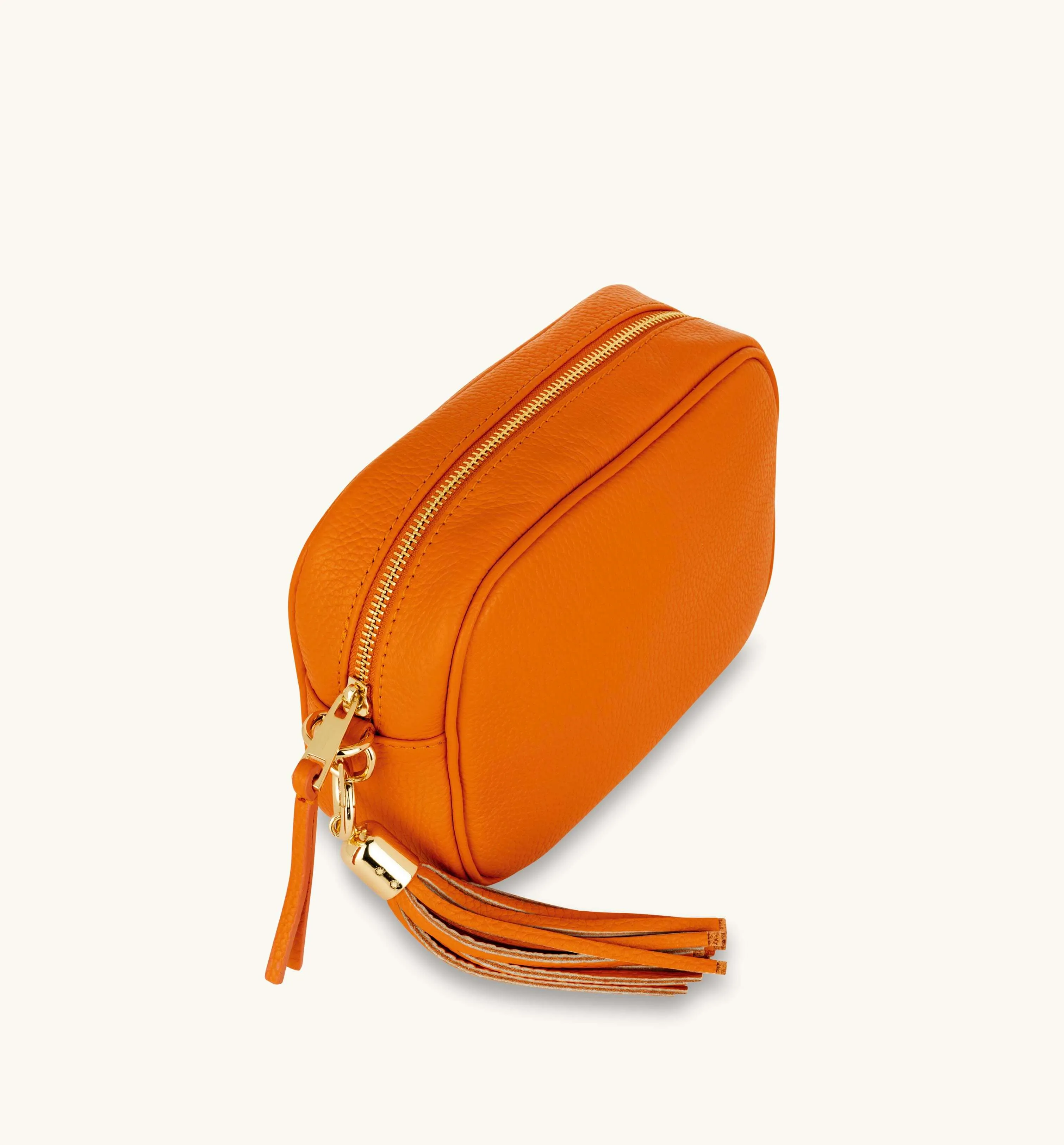 The Tassel Orange Leather Crossbody Bag With Orange & Gold Stripe Camo Strap