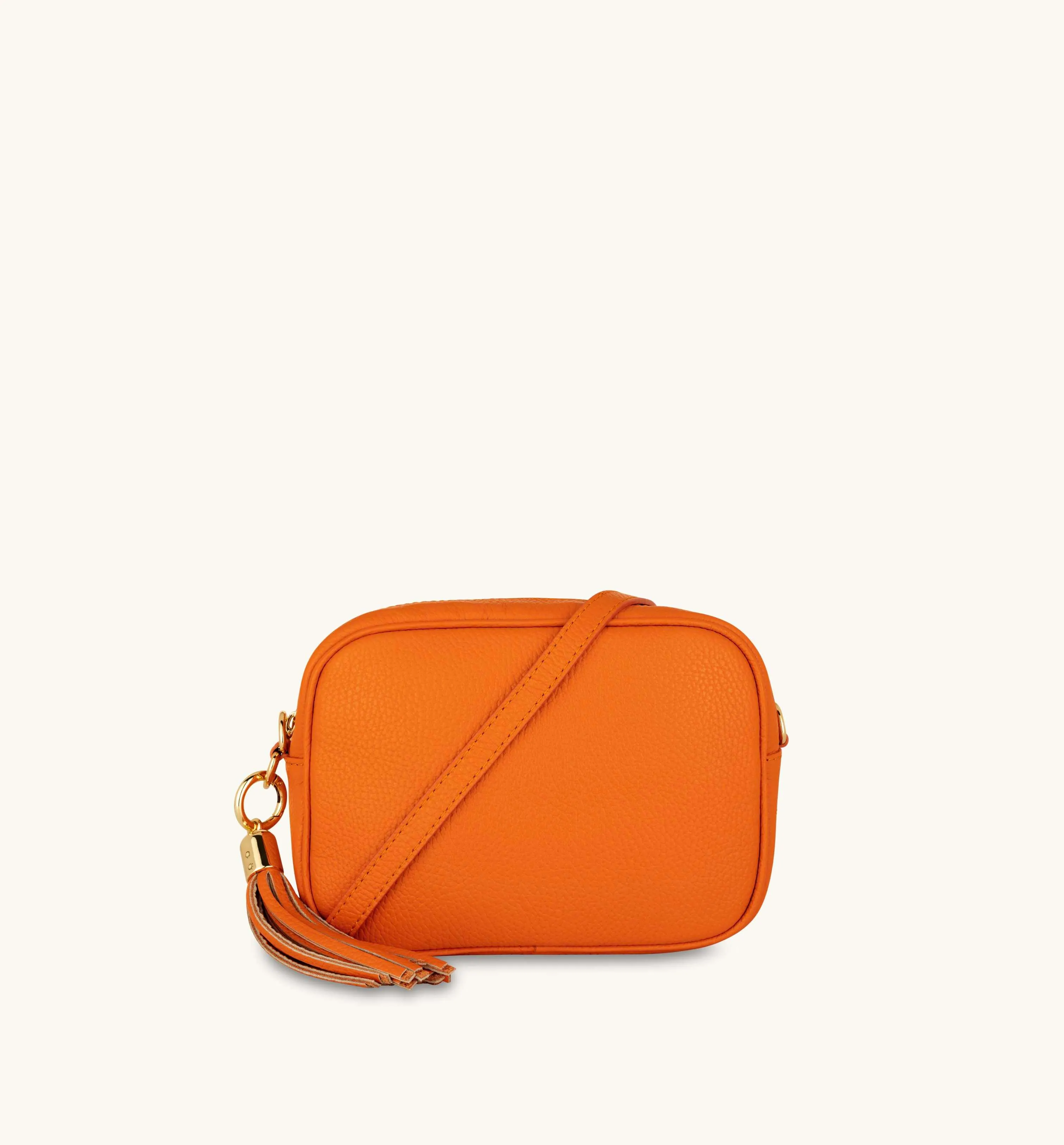 The Tassel Orange Leather Crossbody Bag With Orange & Gold Stripe Camo Strap